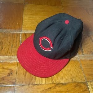 New Era Cincinnati Reds black and red fitted cap.